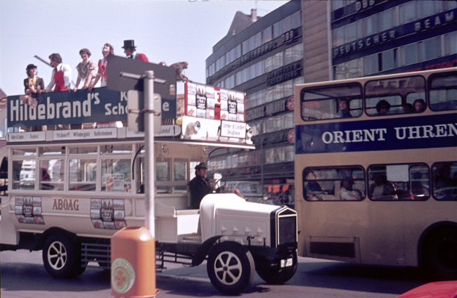 Berlin (West), Germany, 1977. Promotional tour with a vintage bus on Berlin's Kurfürstendamm. Furthermore: Promotion Team, bus driver and passengers.